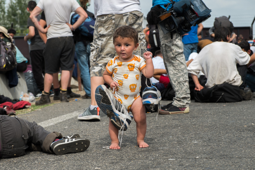 Horgoš on Tuesday. Bisal from Syria, 9 months, learning to walk at the Hungarian border. Photo by author.